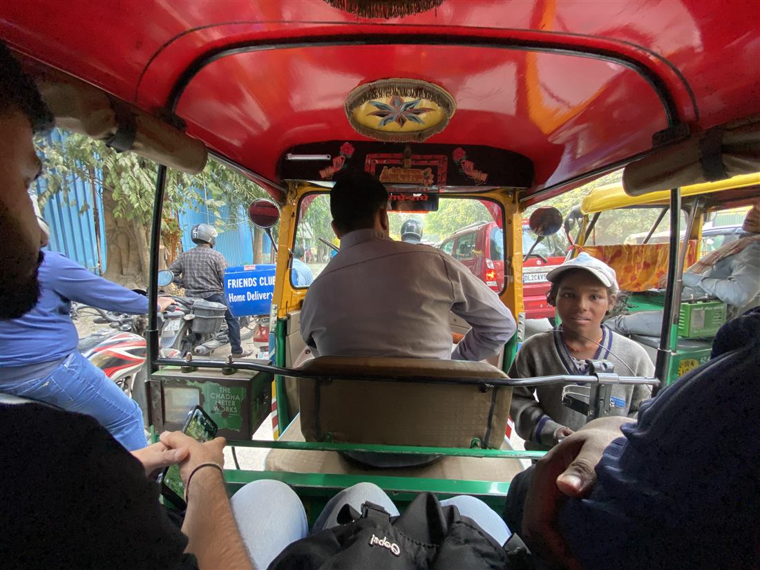 Inside an auto rickshaw in traffic