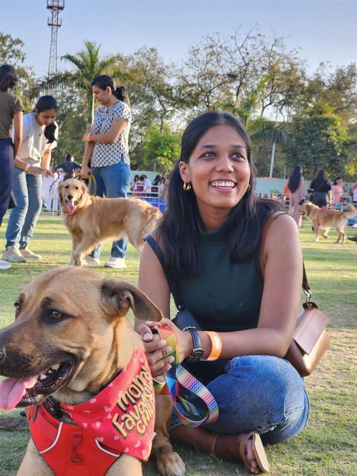 Anushree with dogs at a park event
