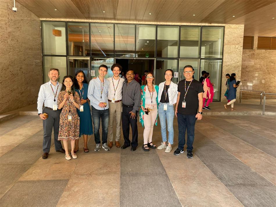 Team standing outside the office building